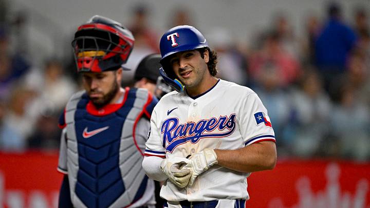 Jun 18, 2026; Arlington, Texas, USA; Texas Rangers second baseman Josh Smith (8) grabs his hand as he bats against the Minnesota Twins during the second inning at Globe Life Field. Mandatory Credit: Jerome Miron-Imagn Images
