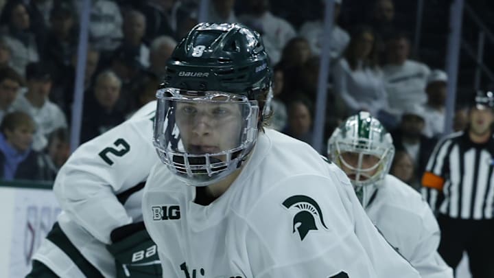 Michigan State's Maxim Strbak (8) chases the puck during a game against Michigan at Munn Ice Arena on Friday, Dec. 5, 2025.