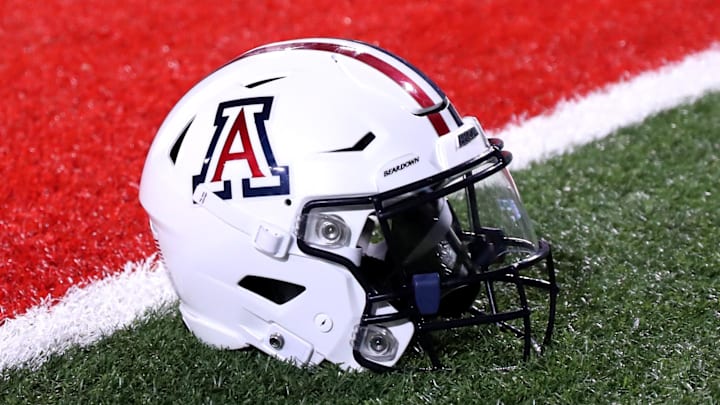 Sep 2, 2023; Tucson, Arizona, USA; Arizona Wildcats quarterback Jayden de Laura (7) helmet on the field after a victory over Northern Arizona Lumberjacks at Arizona Stadium. Mandatory Credit: Zac BonDurant-Imagn Images Sep 2, 2023; Tucson, Arizona, USA; Arizona Wildcats quarterback Jayden de Laura (7) helmet on the field after a victory over Northern Arizona Lumberjacks at Arizona Stadium. Mandatory Credit: Zac BonDurant-Imagn Images