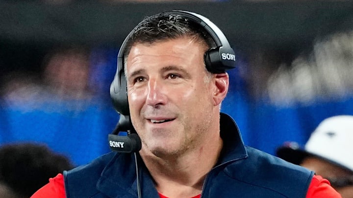 New England Patriots Head Coach, Mike Vrabel is shown on the sideline.