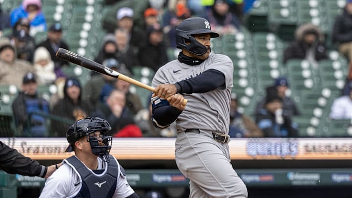 Apr 7, 2025; Detroit, Michigan, USA; New York Yankees outfielder Trent Grisham (12) hits a single in the fifth inning against the Detroit Tigers at Comerica Park. 