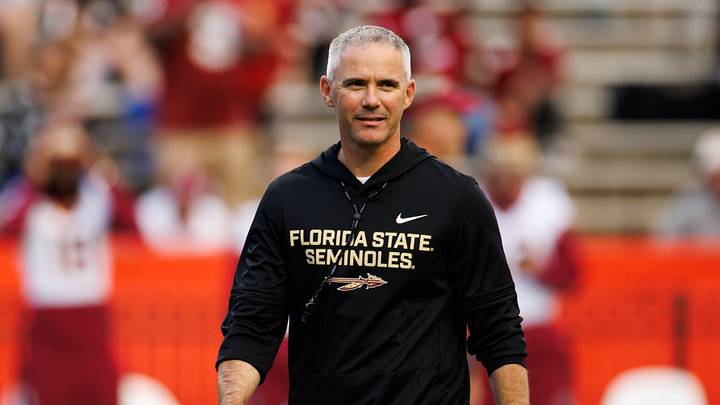 Nov 29, 2025; Gainesville, Florida, USA; Florida State Seminoles head coach Mike Norvell walks on the field before a game against the Florida Gators at Ben Hill Griffin Stadium. Mandatory Credit: Matt Pendleton-Imagn Images