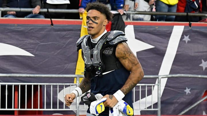 Nov 17, 2024; Foxborough, Massachusetts, USA;  New England Patriots cornerback Christian Gonzalez (0) leaves the field after game against the Los Angeles Rams at Gillette Stadium. Mandatory Credit: Eric Canha-Imagn Images