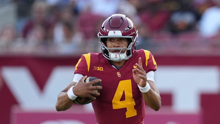 Aug 30, 2025; Los Angeles, California, USA; Southern California Trojans quarterback Husan Longstreet (4) carries the ball against the Missouri State Bears in the second half at United Airlines Field at Los Angeles Memorial Coliseum. Mandatory Credit: Kirby Lee-Imagn Images