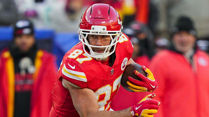 Dec 14, 2025; Kansas City, Missouri, USA; Kansas City Chiefs tight end Travis Kelce (87) runs with the ball during the second half against the Los Angeles Chargers at GEHA Field at Arrowhead Stadium. Mandatory Credit: Jay Biggerstaff-Imagn Images