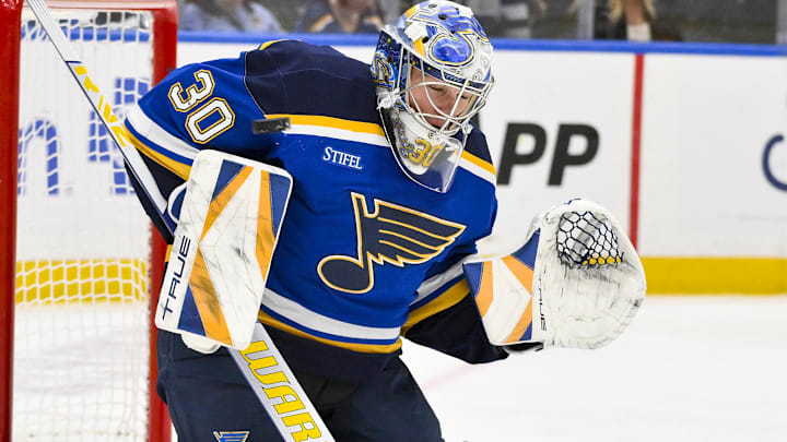 Apr 3, 2025; St. Louis, Missouri, USA;  St. Louis Blues goaltender Joel Hofer (30) defends the net against the Pittsburgh Penguins during the third period at Enterprise Center. Mandatory Credit: Jeff Curry-Imagn Images
