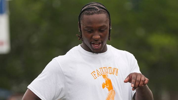 Tennessee quarterback Faizon Brandon speaks to a camper at his Youth Football Camp at Anderson County High School on July 25, 2026. Tennessee quarterback Faizon Brandon speaks to a camper at his Youth Football Camp at Anderson County High School on July 25, 2026.