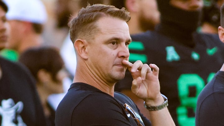 North Texas Mean Green head coach Eric Morris watches his team warm up prior to a game against the South Florida Bulls at DATCU Stadium. North Texas Mean Green head coach Eric Morris watches his team warm up prior to a game against the South Florida Bulls at DATCU Stadium.