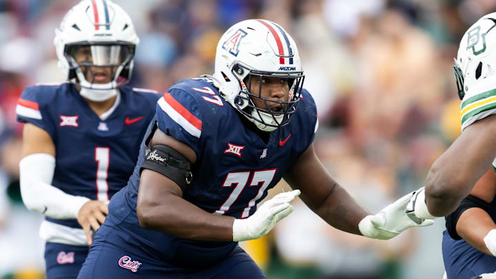 Nov 22, 2025; Tucson, Arizona, USA; Arizona Wildcats offensive lineman Michael Wooten (77) against the Baylor Bears at Casino Del Sol Stadium. Mandatory Credit: Mark J. Rebilas-Imagn Images Nov 22, 2025; Tucson, Arizona, USA; Arizona Wildcats offensive lineman Michael Wooten (77) against the Baylor Bears at Casino Del Sol Stadium. Mandatory Credit: Mark J. Rebilas-Imagn Images