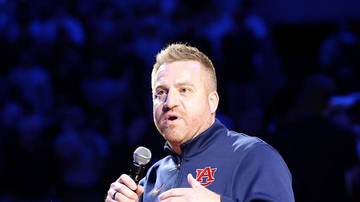 Dec 3, 2025; Auburn, Alabama, USA; Auburn Tigers head football coach Alex Golesh is introduced during the first half of a basketball game between the Auburn Tigers and NC State Wolfpack at Neville Arena. Mandatory Credit: John Reed-Imagn Images