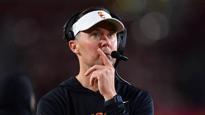 Southern California Trojans head coach Lincoln Riley watches game action.