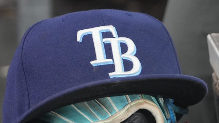 Sep 26, 2025; Toronto, Ontario, CAN; The hat and glove of Tampa Bay Rays third baseman Junior Caminero (13) in the dugout during the game against the Toronto Blue Jays at Rogers Centre. 
