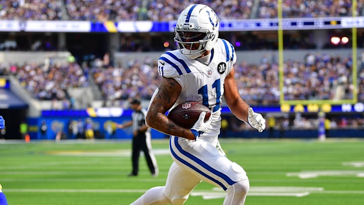 Sep 28, 2025; Inglewood, California, USA; Indianapolis Colts wide receiver Michael Pittman (11) scores a touchdown ahead of Los Angeles Rams cornerback Emmanuel Forbes Jr. (1) during the second half at SoFi Stadium. Mandatory Credit: Gary A. Vasquez-Imagn Images Sep 28, 2025; Inglewood, California, USA; Indianapolis Colts wide receiver Michael Pittman (11) scores a touchdown ahead of Los Angeles Rams cornerback Emmanuel Forbes Jr. (1) during the second half at SoFi Stadium. Mandatory Credit: Gary A. Vasquez-Imagn Images