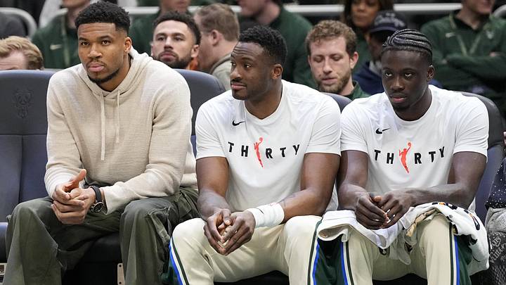 Apr 10, 2026; Milwaukee, Wisconsin, USA;  Milwaukee Bucks forward Giannis Antetokounmpo (34),  forward Thanasis Antetokounmpo (43) and forward Alex Antetokounmpo (29) sit on the bench during the first quarterq against the Brooklyn Nets at Fiserv Forum. Mandatory Credit: Jeff Hanisch-Imagn Images