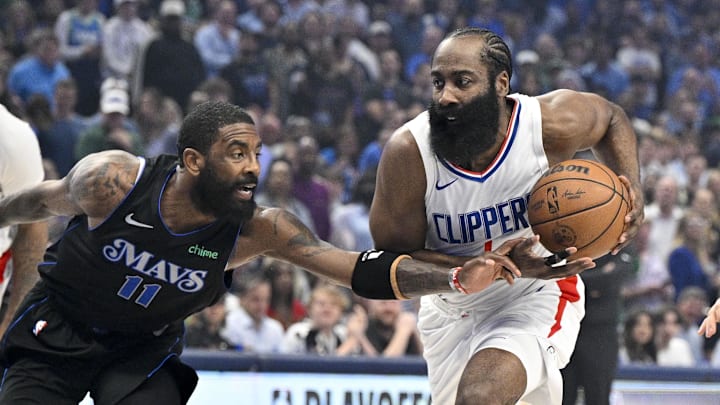 May 3, 2024; Dallas, Texas, USA; LA Clippers guard James Harden (1) drives to the basket past Dallas Mavericks guard Kyrie Irving (11) during the first quarter during game six of the first round for the 2024 NBA playoffs at American Airlines Center. Mandatory Credit: Jerome Miron-Imagn Images