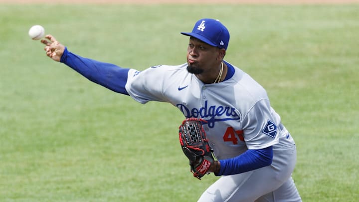 Los Angeles Dodgers pitcher Alexis Diaz throws a baseball during a game.