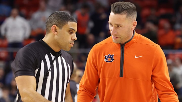Dec 3, 2025; Auburn, Alabama, USA;  Auburn Tigers head coach Steven Pearl speaks with an official during the first half against the NC State Wolfpack at Neville Arena. Mandatory Credit: John Reed-Imagn Images