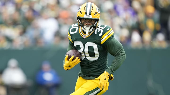 Nov 23, 2025; Green Bay, Wisconsin, USA; Green Bay Packers running back Chris Brooks (30) runs after the catch against the Minnesota Vikings during the first half at Lambeau Field. Mandatory Credit: Kayla Wolf-Imagn Images