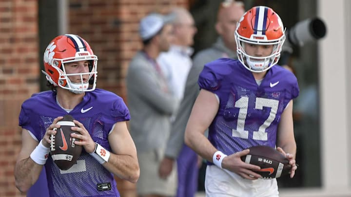 Clemson quarterback Cade Klubnik (2) runs in a drill near quarterback Christopher Vizzina (17) during fall camp.