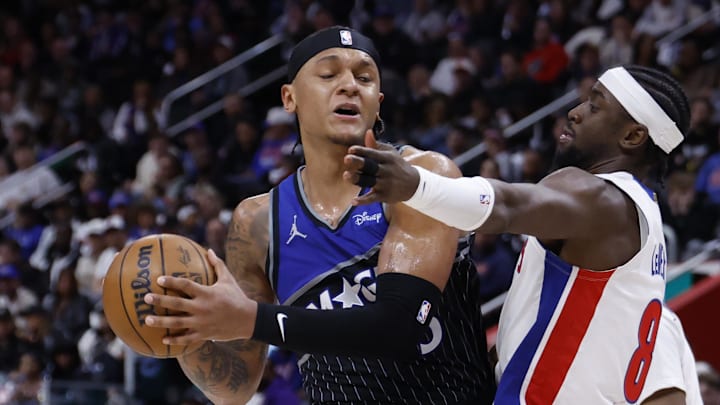 Apr 29, 2026; Detroit, Michigan, USA; Orlando Magic forward Paolo Banchero (5) is defended by Detroit Pistons guard Caris LeVert (8) in the first half during game five of the first round of the 2026 NBA Playoffs at Little Caesars Arena. Mandatory Credit: Rick Osentoski-Imagn Images