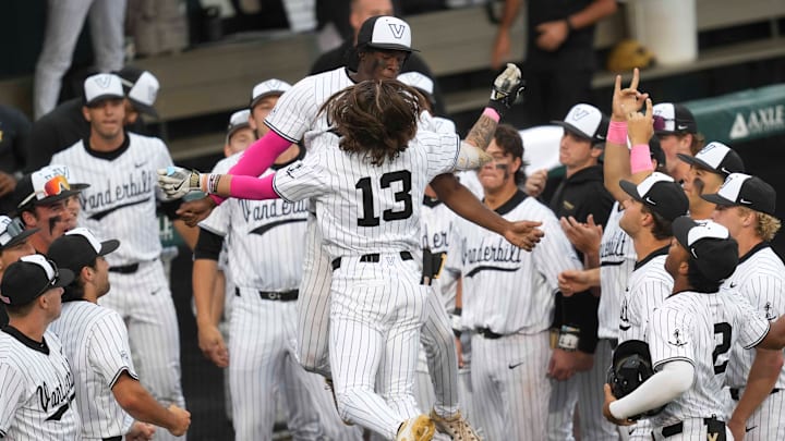Vanderbilt infielder Jonathan Vastine (13) celebrates with Vanderbilt utility RJ Austin (42) after Vastine hits a home run during a NCAA baseball game between the Tennessee Volunteers and Vanderbilt Commodores at Lindsey Nelson Stadium on May 11, 2025. Vanderbilt won 7-5 against Tennessee. Vanderbilt infielder Jonathan Vastine (13) celebrates with Vanderbilt utility RJ Austin (42) after Vastine hits a home run during a NCAA baseball game between the Tennessee Volunteers and Vanderbilt Commodores at Lindsey Nelson Stadium on May 11, 2025. Vanderbilt won 7-5 against Tennessee.
