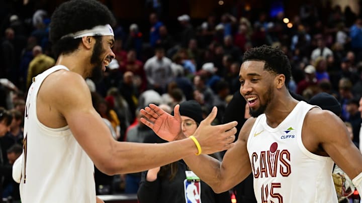 Jan 8, 2025; Cleveland, Ohio, USA; Cleveland Cavaliers guard Donovan Mitchell (45) celebrates with center Jarrett Allen (31) after the Cavaliers beat the Oklahoma City Thunder at Rocket Mortgage FieldHouse. Mandatory Credit: Ken Blaze-Imagn Images