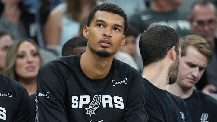 Dec 18, 2025; San Antonio, Texas, USA; San Antonio Spurs forward Victor Wembanyama (1) watches during the first quarter against the Washington Wizards at Frost Bank Center.