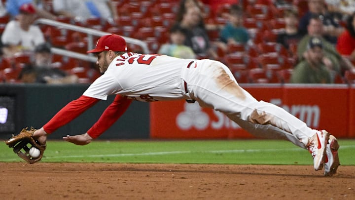 Sep 18, 2024; St. Louis, Missouri, USA;  St. Louis Cardinals third baseman Nolan Arenado (28) dives but is unable to field a ground ball hit by Pittsburgh Pirates center fielder Billy Cook (not pictured) during the ninth inning at Busch Stadium.