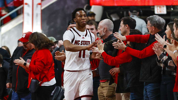 Feb 7, 2026; Raleigh, North Carolina, USA;  NC State Wolfpack guard Quadir Copeland (11) thanks the fans after the second half of the game against the Virginia Tech Hokies at Lenovo Center. Mandatory Credit: Jaylynn Nash-Imagn Images