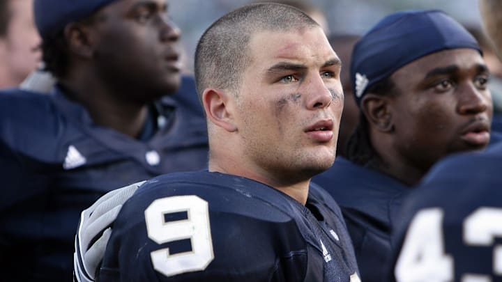 Sep. 1, 2007; South Bend, IN, USA; Notre Dame Fighting Irish defensive back Tom Zbikowski (9) sings the Notre Dame Alma Mater with his teammates after the Georgia Tech Yellow Jackets beat Notre Dame 33-3 at Notre Dame Stadium. 