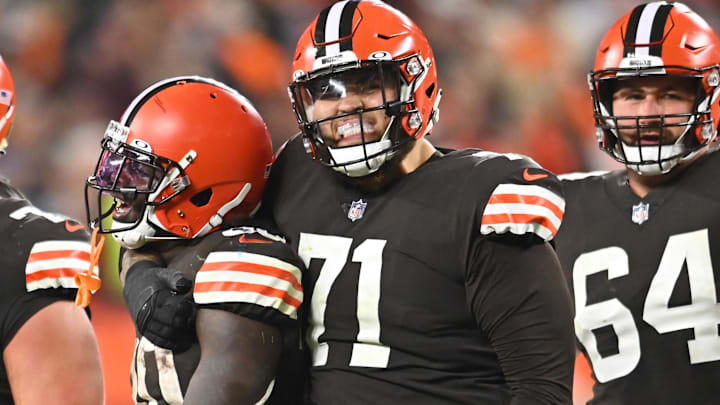 Oct 21, 2021; Cleveland, Ohio, USA; Cleveland Browns running back D'Ernest Johnson (30) celebrates with guard Wyatt Teller (77) and offensive tackle Jedrick Wills (71) and center JC Tretter (64) after rushing for a first down and securing the game during the fourth quarter against the Denver Broncos at FirstEnergy Stadium. Mandatory Credit: Ken Blaze-Imagn Images
