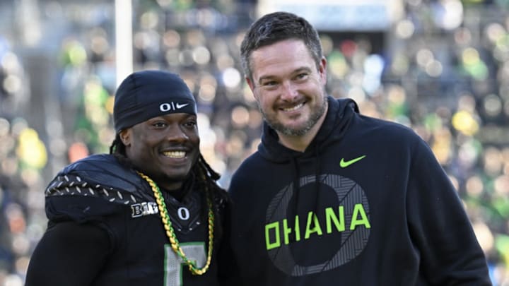 Nov 22, 2025; Eugene, Oregon, USA; Oregon Ducks running back Noah Whittington (6) poses for a photo with head coach Dan Lanning before the game against the Southern California Trojans at Autzen Stadium. Mandatory Credit: Troy Wayrynen-Imagn Images