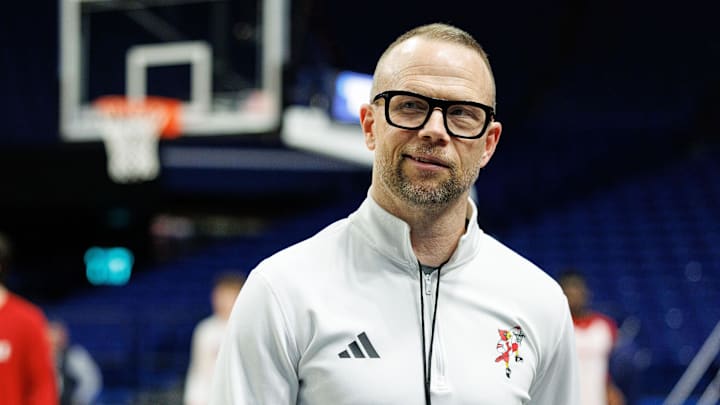 Mar 19, 2025; Lexington, KY, USA; Louisville Cardinals head coach Pat Kelsey talks to media members on the sideline during practice at Rupp Arena. Mandatory Credit: Jordan Prather-Imagn Images Mar 19, 2025; Lexington, KY, USA; Louisville Cardinals head coach Pat Kelsey talks to media members on the sideline during practice at Rupp Arena. Mandatory Credit: Jordan Prather-Imagn Images