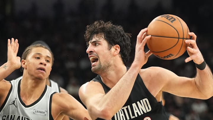 Portland Trail Blazers forward Deni Avdija drives to the basket against San Antonio Spurs forward Carter Bryant. Portland Trail Blazers forward Deni Avdija drives to the basket against San Antonio Spurs forward Carter Bryant.