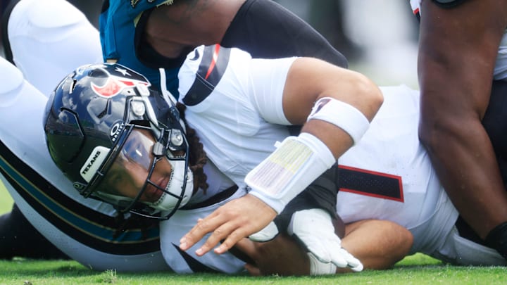 Houston Texans quarterback CJ. Stroud (7) is sacked by Jacksonville Jaguars defensive end Travon Walker (44) during the first quarter of an NFL football matchup at EverBank Stadium, Sunday, Sept. 21, 2025, in Jacksonville, Fla. [Corey Perrine/Florida Times-Union]