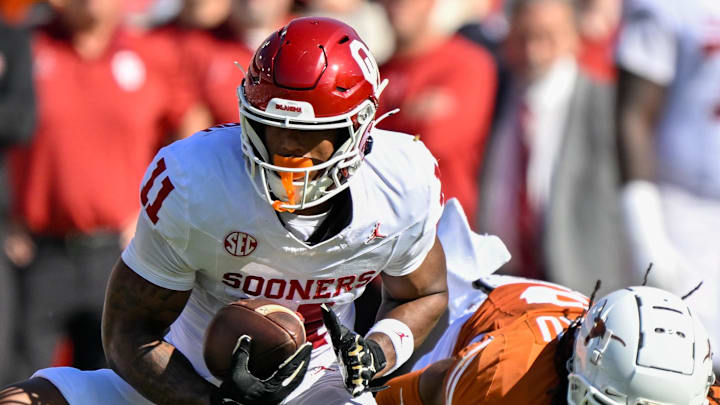 Oklahoma Sooners wide receiver Javonnie Gibson (11) runs with the ball during the game between the Texas Longhorns and the Oklahoma Sooners at the Cotton Bowl in October.