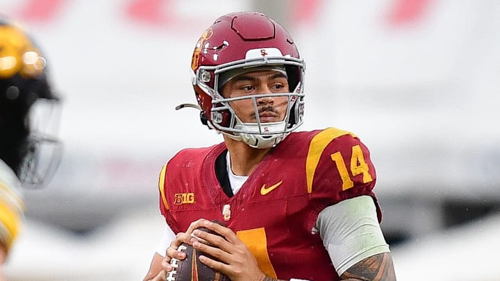 Nov 15, 2025; Los Angeles, California, USA; Southern California Trojans quarterback Jayden Maiava (14) drops back to pass against the Iowa Hawkeyes during the second half at the Los Angeles Memorial Coliseum. Mandatory Credit: Gary A. Vasquez-Imagn Images