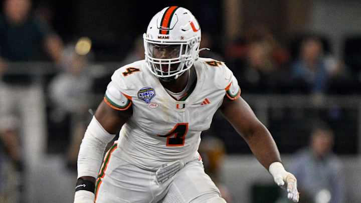 Dec 31, 2025; Arlington, TX, USA; Miami Hurricanes defensive lineman Rueben Bain Jr. (4) rushes the line during the 2025 Cotton Bowl and quarterfinal game of the College Football Playoff at AT&T Stadium. Mandatory Credit: Jerome Miron-Imagn Images