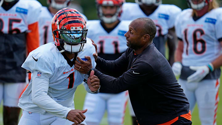 Cincinnati Bengals wide receiver Ja'Marr Chase (1) runs through a drill with wide receivers coach Troy Walters during a training camp practice at the Paycor Stadium practice fields in downtown Cincinnati on Wednesday, Aug. 17, 2022.

Cincinnati Bengals Training Camp