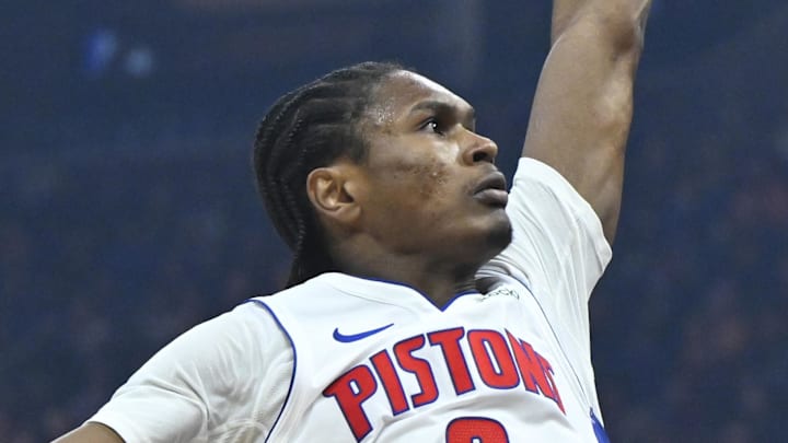 Mar 3, 2026; Cleveland, Ohio, USA; Cleveland Cavaliers guard Dennis Schroder (8) lays up a shot beside Detroit Pistons guard Ausar Thompson (9) in the third quarter at Rocket Arena. Mandatory Credit: David Richard-Imagn Images