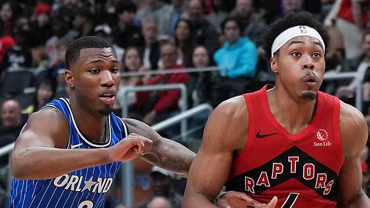 Toronto Raptors forward Scottie Barnes drives to the basket as Orlando Magic forward Jamal Cain tries to defend.