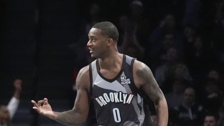 Apr 6, 2025; Brooklyn, New York, USA; Brooklyn Nets forward Dariq Whitehead (0) reacts to making a three point shot against the Toronto Raptors during the first half at Barclays Center. Mandatory Credit: Gregory Fisher-Imagn Images