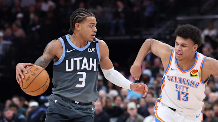 Dec 7, 2025; Salt Lake City, Utah, USA; Utah Jazz guard Keyonte George (3) moves the ball as Oklahoma City Thunder forward Ousmane Dieng (13) defends during the second half at Delta Center. Mandatory Credit: Rob Gray-Imagn Images