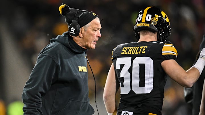 Iowa Hawkeyes head coach Kirk Ferentz reacts as defensive back Quinn Schulte looks on during the first quarter.