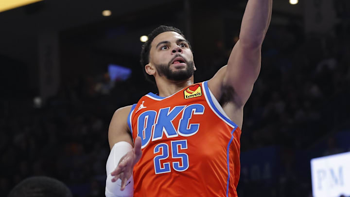 Nov 11, 2025; Oklahoma City, Oklahoma, USA; Oklahoma City Thunder guard Ajay Mitchell (25) goes to the basket against the Golden State Warriors during the second quarter at Paycom Center. Mandatory Credit: Alonzo Adams-Imagn Images
