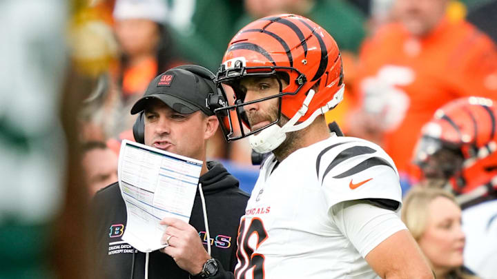 Oct 12, 2025; Green Bay, Wisconsin, USA; Cincinnati Bengals head coach Zac Taylor speaks with quarterback Joe Flacco (16) during the third quarter against the Green Bay Packers at Lambeau Field. Mandatory Credit: Kayla Wolf-Imagn Images