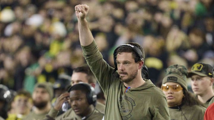 Nov 11, 2023; Eugene, Oregon, USA; Oregon Ducks head coach Dan Lanning signals to his defense during the first half against the USC Trojans at Autzen Stadium. Mandatory Credit: Troy Wayrynen-Imagn Images