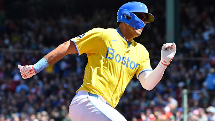 Boston Red Sox catcher Blake Sabol (18) scores a run on a hit by left fielder Jarren Duran (not pictured) during the second inning against the Chicago White Sox at Fenway Park.