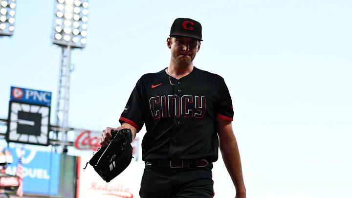 Cincinnati Reds pitcher Nick Lodolo (40) walks to the dugout