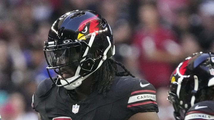 Arizona Cardinals defensive end Darius Robinson (56) walks back to the huddle during the fourth quarter against the Seattle Seahawks at State Farm Stadium in Glendale on Dec. 8, 2024. Arizona Cardinals defensive end Darius Robinson (56) walks back to the huddle during the fourth quarter against the Seattle Seahawks at State Farm Stadium in Glendale on Dec. 8, 2024.